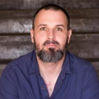 Individual grapples with anxiety, feeling the urge to control their surroundings during emotional turmoil