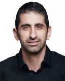 Two men bonding over music, highlighting emotional connections beyond words.