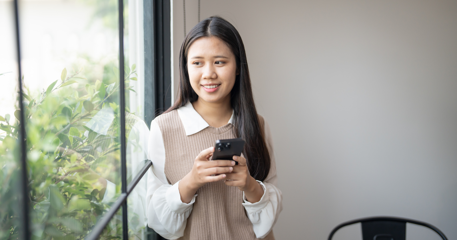 A person hesitates while posting a heartfelt relationship update on social media, feeling anxious.