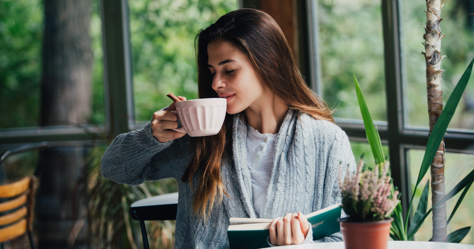 Individual feeling overwhelmed by emotions while practicing mindfulness in a serene environment
