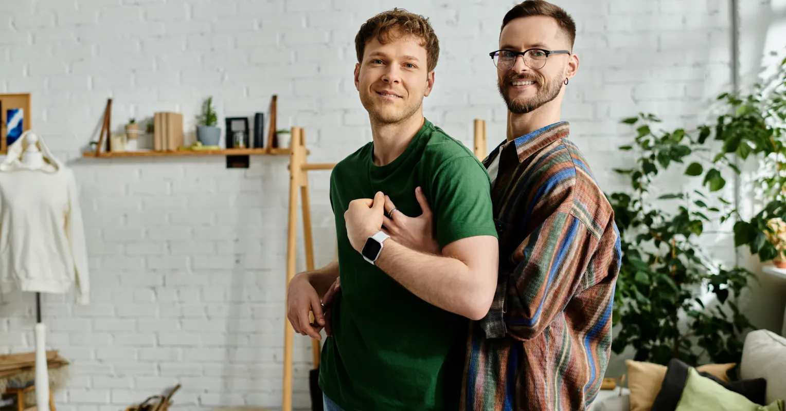 Couple sitting together but appearing emotionally distant despite comforting words.