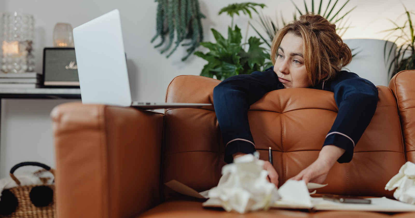 A person sitting alone, contemplating feelings of emotional distance from friends during burnout