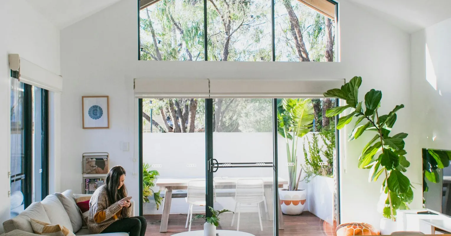 Couple discussing feelings in a tidy, well-organized living space, exploring relationship signals