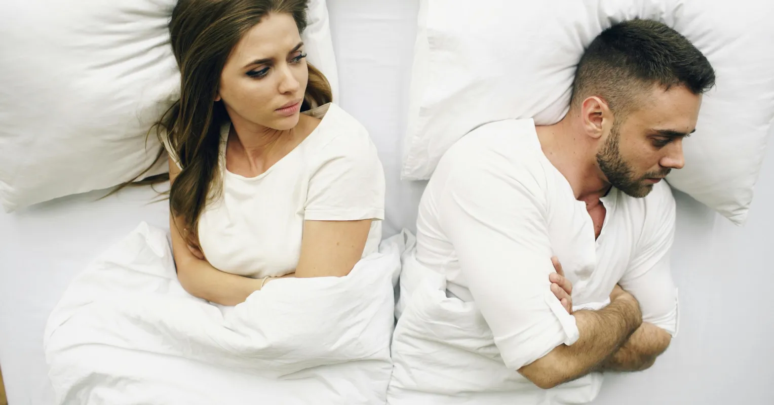 Couple discussing the benefits of scheduling sex to improve relationship satisfaction