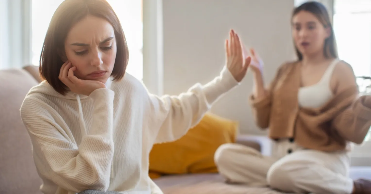 Individual contemplating their emotional triggers shaped by past experiences and sensitivity