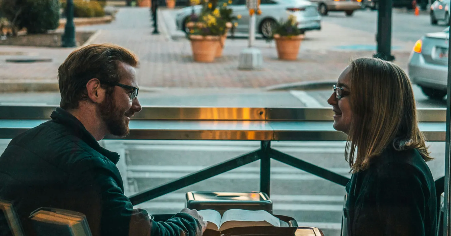 Couple engaging in calm conversation, exploring how to communicate feelings without conflict