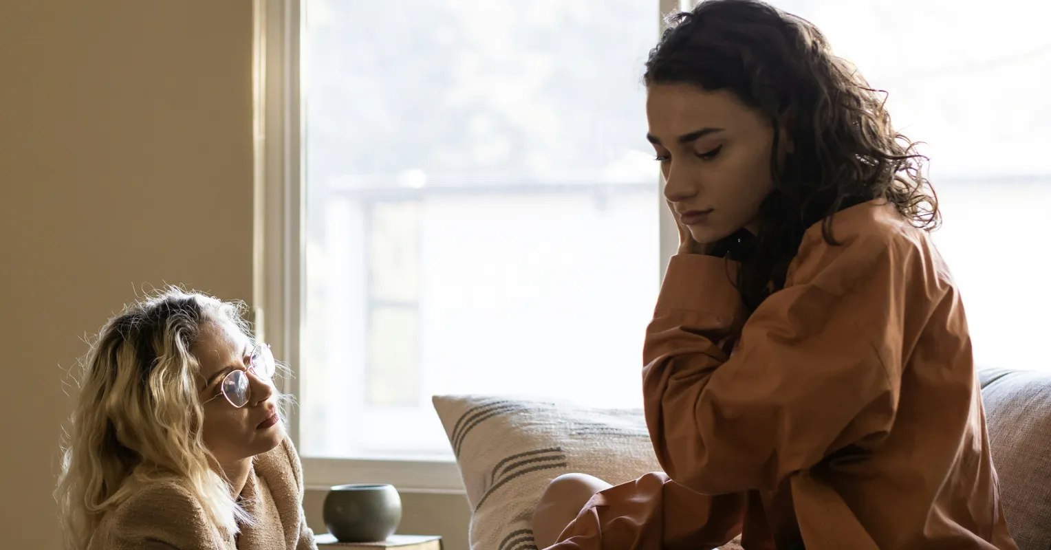 Couple engaging in a heartfelt conversation, fostering a safe space to share fears