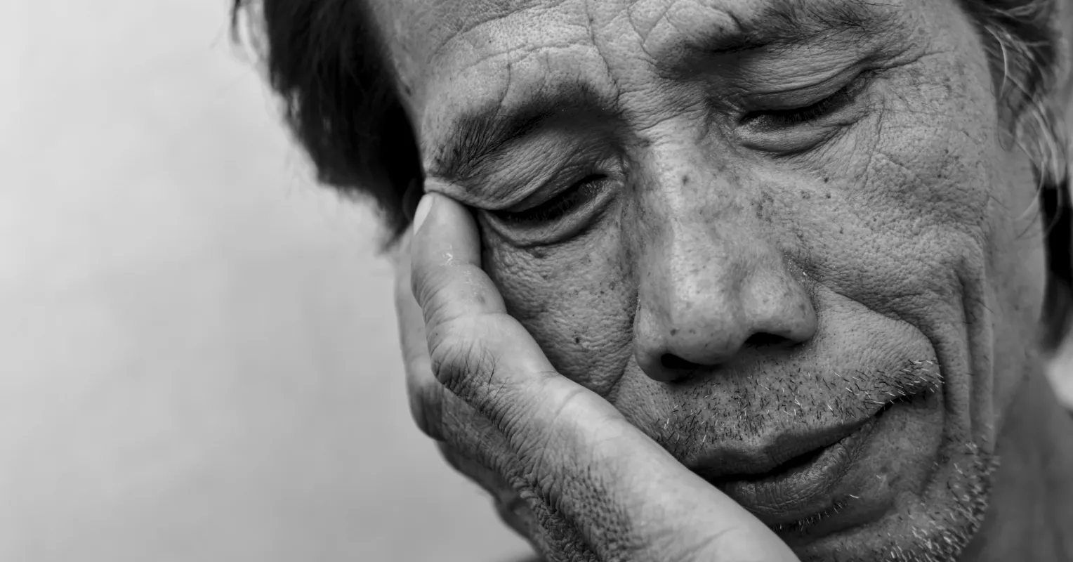 Person reflecting on uncertainty in a relationship connected to how to handle feeling unworthy in a relationship