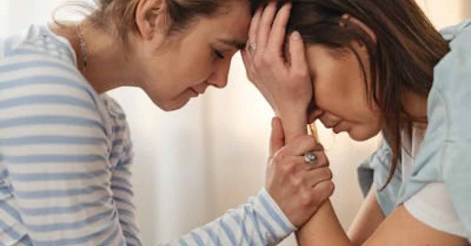 Person contemplating the impact of their emotions on others' feelings in social situations