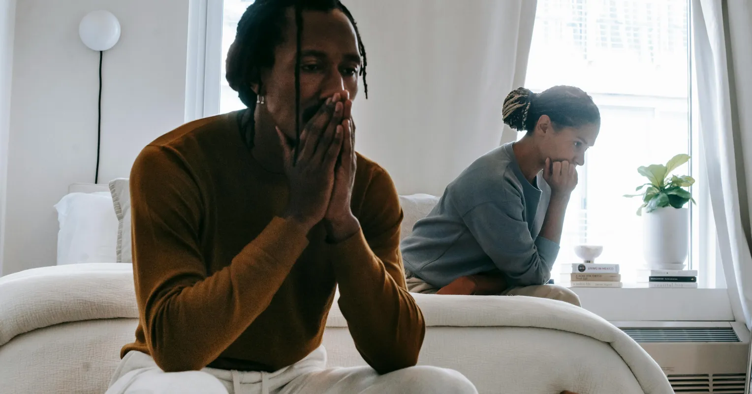 Couple sitting in silence, reflecting on signs of relationship indifference