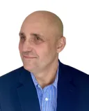 A therapist attentively listens to a client, creating a connection through understanding and empathy.