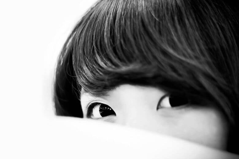 Person reflecting on uncertainty in a relationship connected to how can i tell if my partner is emotionally