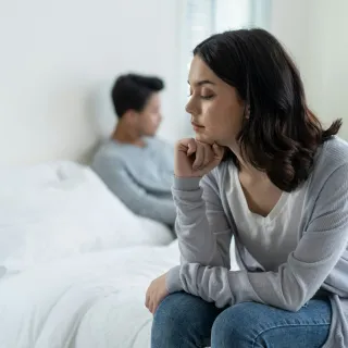 Person reflecting on uncertainty in a relationship connected to how do i know if my partner is emotionally