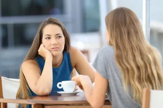 Person reflecting on uncertainty in a relationship connected to partner struggle to engage in deep conversations