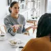 Individual experiencing anxiety while communicating with a distant partner during a conflict