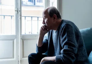 Individual struggling with recognizing emotions due to upbringing, reflecting on emotional signals
