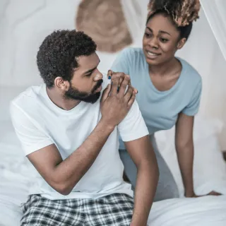 Individual hesitating to share feelings during a challenging conversation about relationship signals