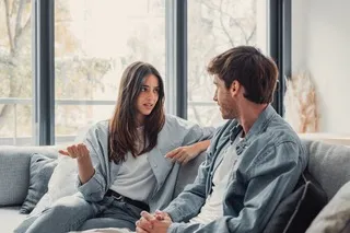 Couple avoiding eye contact, signaling discomfort with hard conversations in their relationship