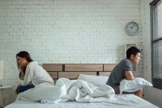 Couple discussing their feelings during an argument, navigating emotional signals and overwhelm