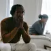 Couple discussing work-related stress and its impact on their relationship dynamics