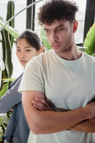 Person reflecting on emotional behavior and meaning connected to why do my arguments always escalate into bigger fights