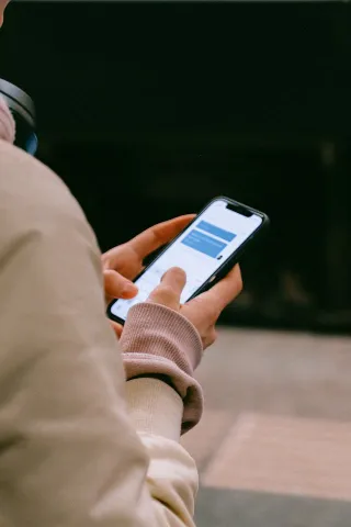 Individual contemplating their texts after an enjoyable date, overthinking relationship signals