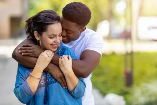 Couple sitting together but appearing emotionally distant after attempts to reconnect