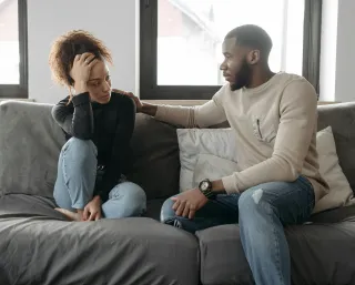 Person feeling confused as their partner shuts down after sharing emotions in conversation