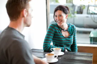 Couple experiencing a conversation, one partner appears lost in thought, indicating distraction