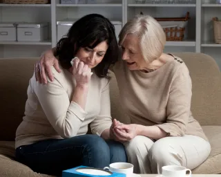 Individual sitting alone, reflecting on why some people withdraw when grieving instead of reaching out