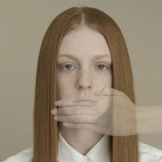 Individual contemplating feelings of anxiety when revealing true emotions to loved ones