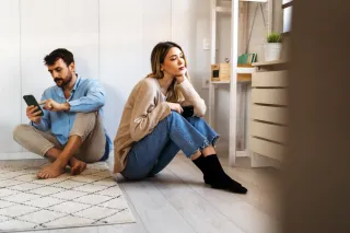 Couple discussing feelings, addressing perceptions of overreacting emotions in relationships