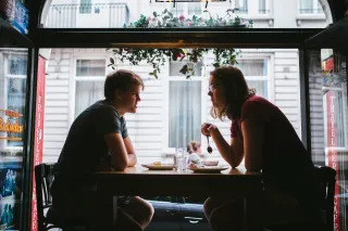 Couple experiencing emotional distance after a heated argument in their living room