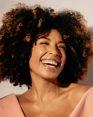 A stranger smiling warmly, illustrating hidden social dynamics in human interactions