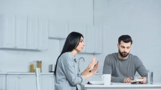 Couple sitting in silence, navigating tough conversations about emotions and relationship signals