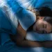 Person contemplating the meaning behind recurring dreams about an ex, reflecting on past relationship signals