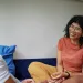 Person looking anxious while discussing intense emotions with their partner.
