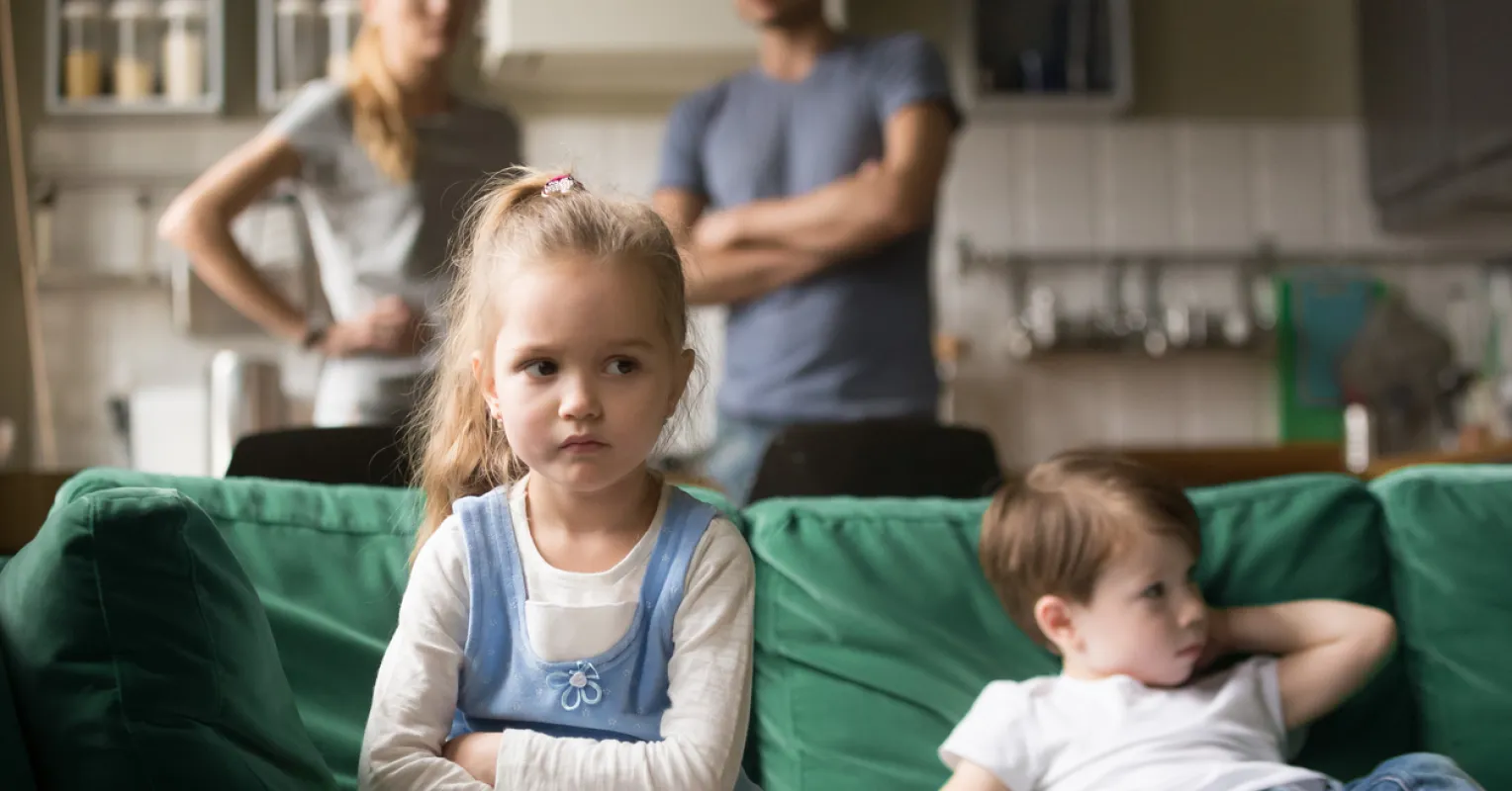 Parent observing children mimicking their relationship behaviors and dynamics