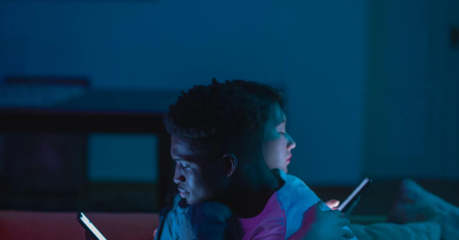 Couple sitting together, reflecting on how news affects their emotional connection and intimacy