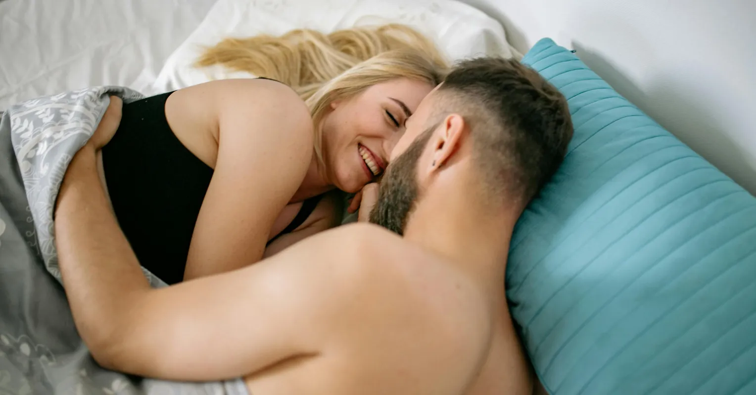 Couple having an intimate conversation, showcasing openness to new sexual experiences.