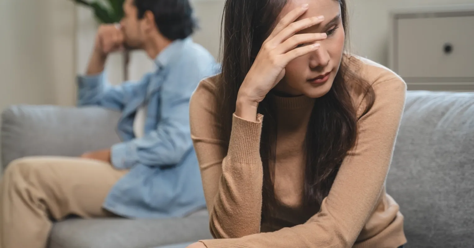 A couple discussing emotional needs, highlighting signs of feeling overwhelmed in relationships
