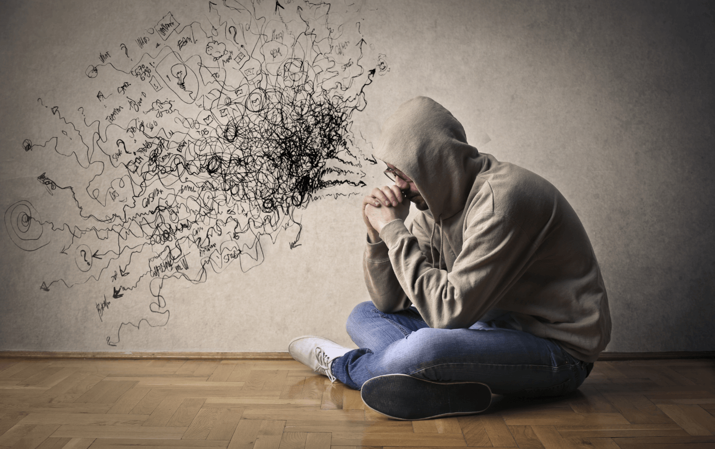Person contemplating their insecurities regarding their partner's feelings in a quiet space