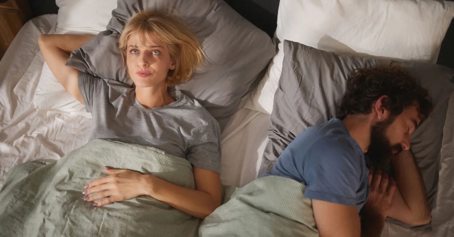 Person reflecting on emotional distance and withdrawal connected to what causes women to pull away emotionally after...