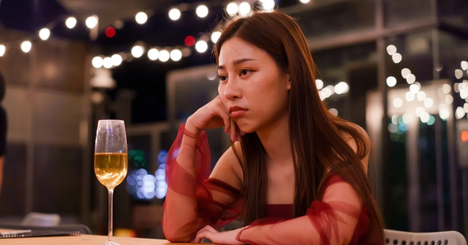 Person pondering emotional turmoil after dreaming about an ex following a breakup