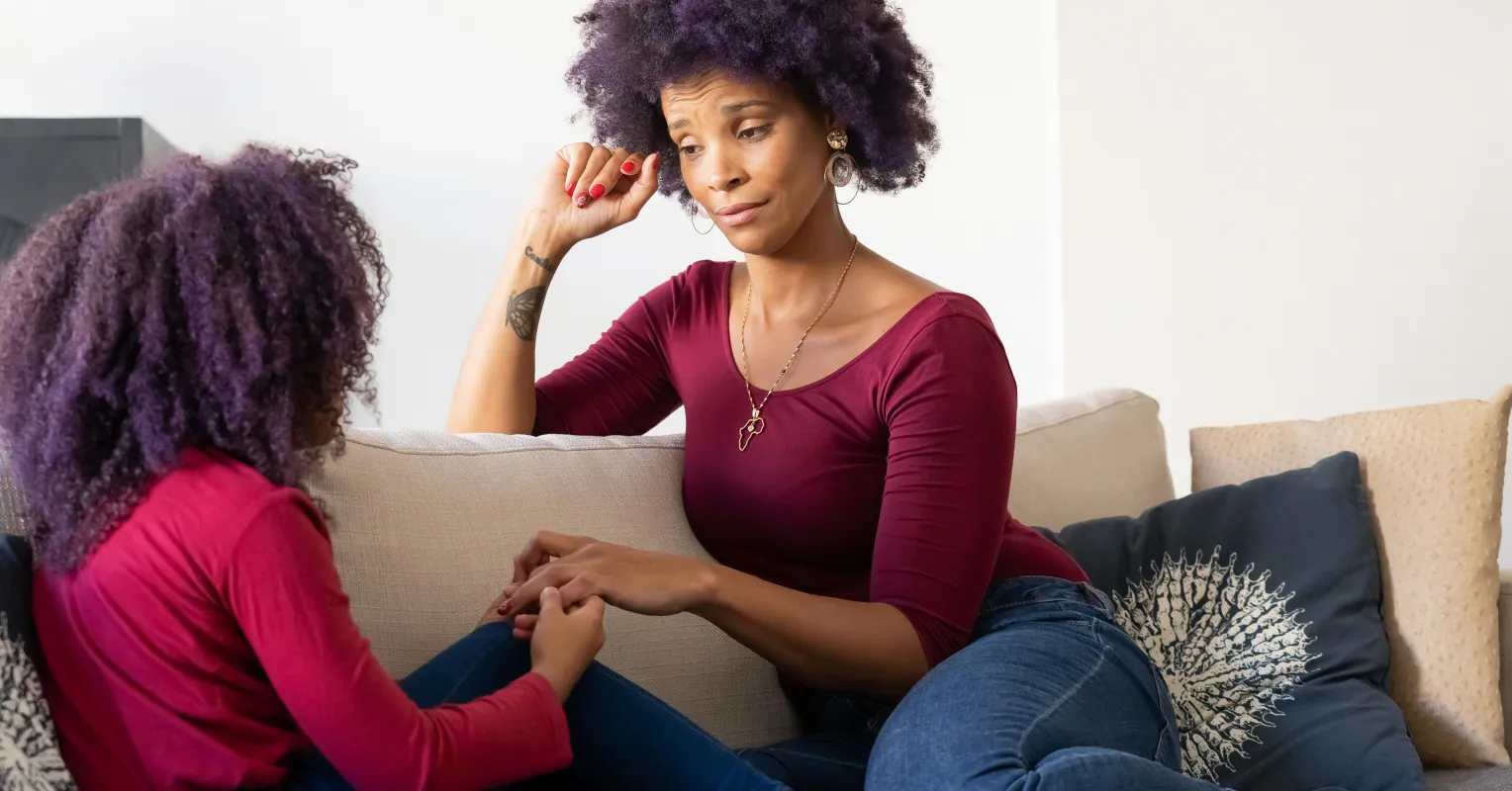 Parent observing child who seems to hide something trivial, exploring human behavior