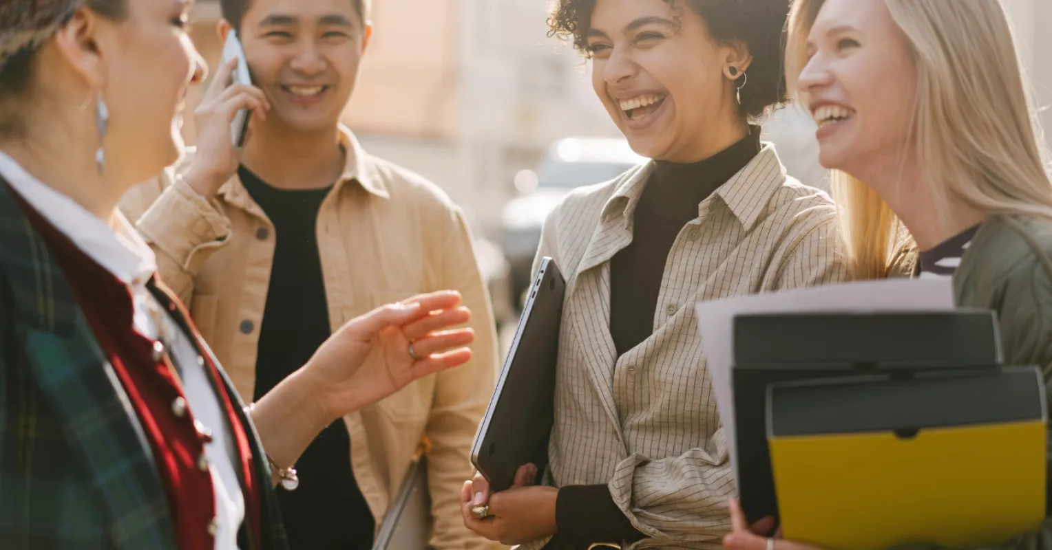 A person sharing a genuine smile with a stranger in a public space, illustrating social dynamics.