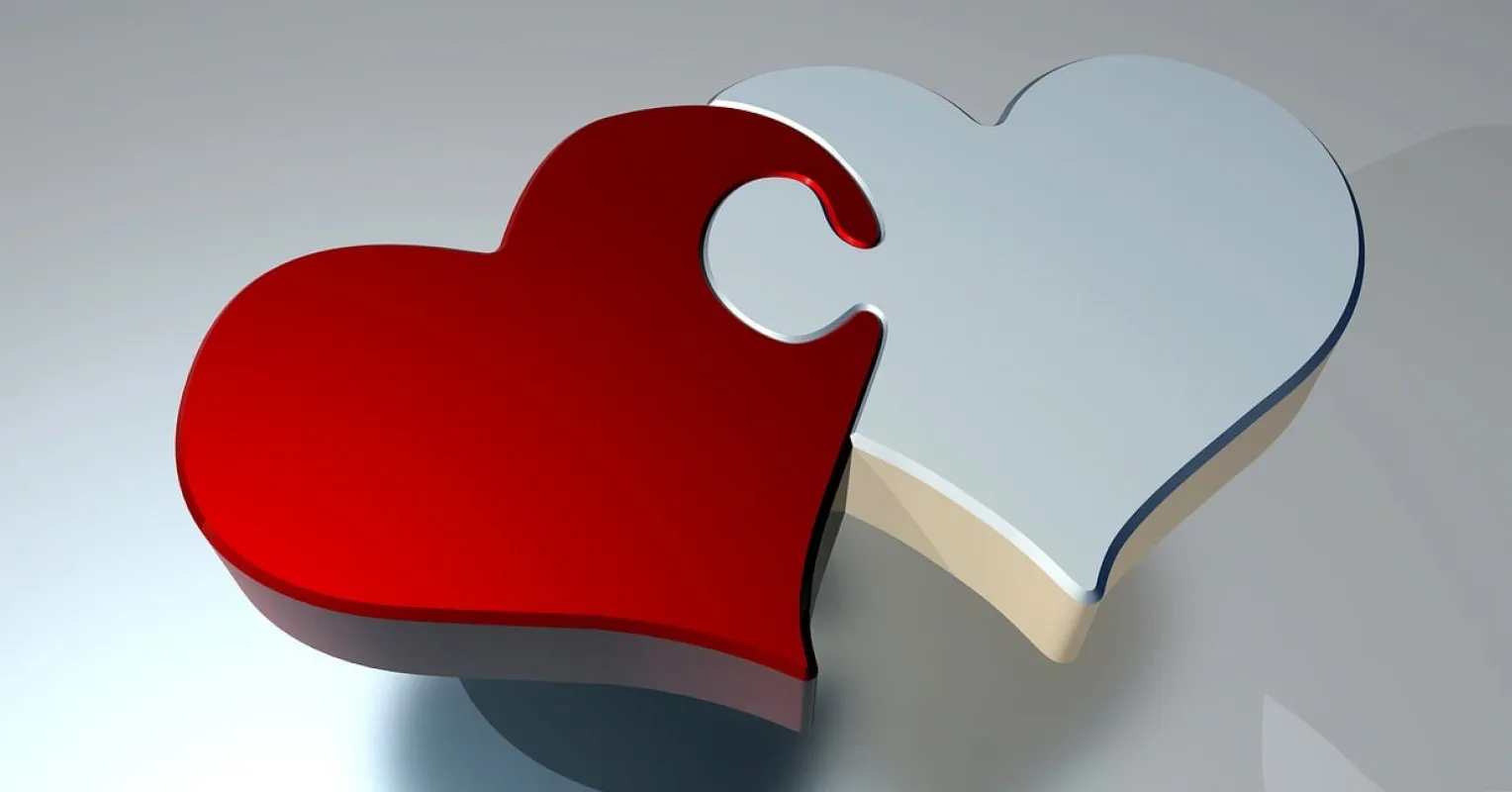 A couple sitting together in silence, suggesting unresolved feelings and relationship signals.