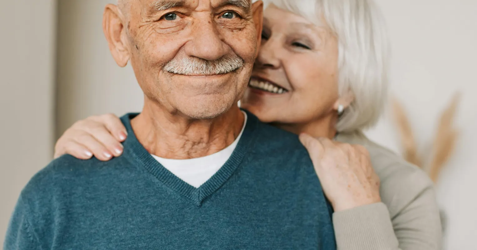 Couple sitting apart, reflecting on what it means if their partner is emotionally distant