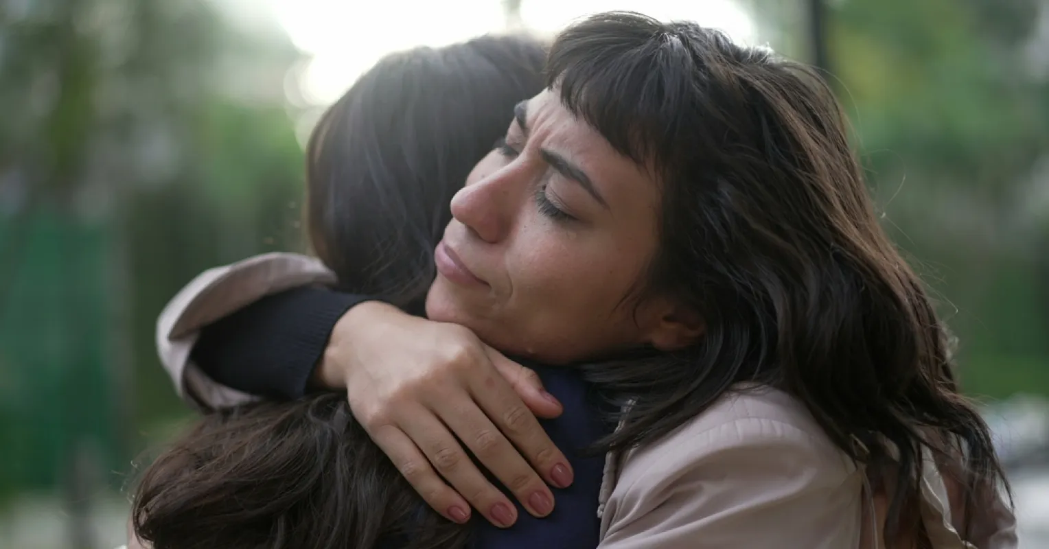 Individual hesitating to seek support, embodying feelings of shame relying on friends