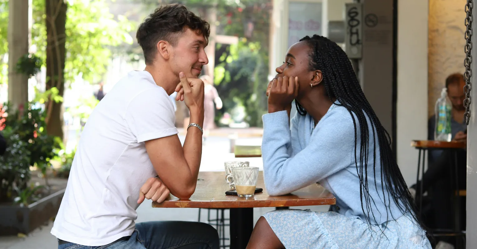 Couple sharing a meaningful conversation, highlighting social attunement over time in relationships
